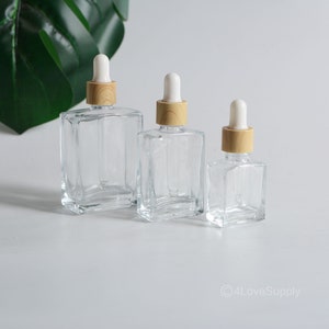 Flaconi contagocce da 15 ml, 30 ml e 50 ml, in vetro quadrato trasparente, con tappo in legno granulato, per contenitori di oli essenziali, per cosmetici, fai da te, logo personalizzato all'ingrosso