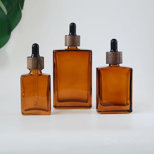 Flacone contagocce quadrato in vetro ambrato da 30 ml, 50 ml e 100 ml, con tappo in legno nero e tubo in vetro per imballaggio cosmetico, oli essenziali per la cura della pelle, ordine all'ingrosso