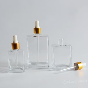 Flaconi contagocce di lusso da 30 ml/50 ml/100 ml con tappo dorato in vetro quadrato trasparente per contenitori di oli essenziali, logo fai da te, imballaggio cosmetico trasparente alla rinfusa