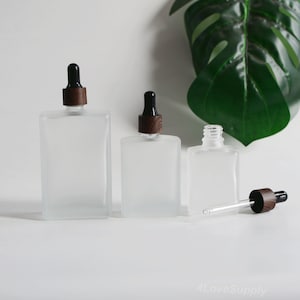Flaconi contagocce da 30 ml, 50 ml e 100 ml con tappo effetto legno nero, in vetro quadrato satinato per la cura della pelle