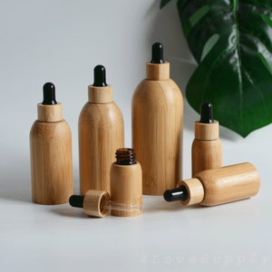 1-200pcs Frasco conta-gotas de bambu natural 15ml-100ml Recipiente de óleo essencial de parede interna de vidro Embalagem ecológica Logotipo personalizado Pedido em massa