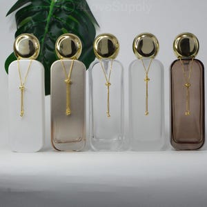 120 ml 4 oz lyxig finsprayflaska med guldkedjor, lyxig parfymbehållare, tonerflaskor för kosmetisk parfym, bulkbeställning