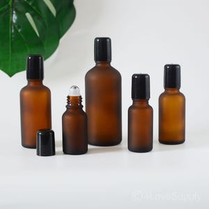 5ml 10ml 15ml 20ml 30ml 50ml 100ml Roller Bottles Matte Amber Glass Black Cap Stainless Ball For Essential Oil SPA Roller Bottles Bulk Order