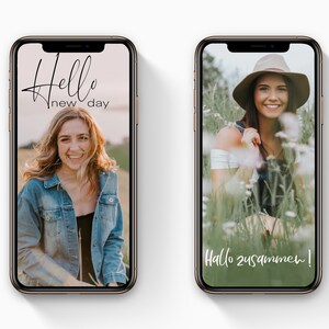 May include: Two smartphones displaying images of a smiling person. The left phone shows a woman in a denim jacket with the text "Hello new day." The right phone displays a woman in a hat and overalls, with the text "Hallo zusammen!"