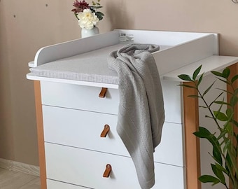 Hot change mat on top of drawers Store
