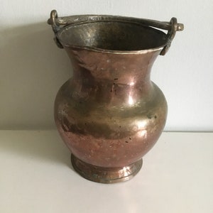 Old copper pot with handle