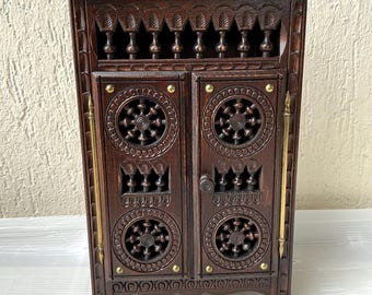 Small antique Breton carved wooden doll cabinet