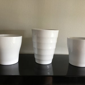 3 white ceramic flower pots