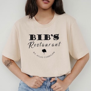 Bib’s Restaurant by Atlas Corrigan T-shirt | Colleen Hoover