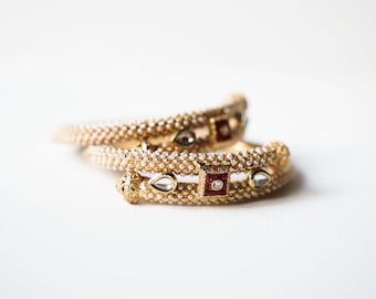 Gold plated bangles with pearls and colour enhanced rubies