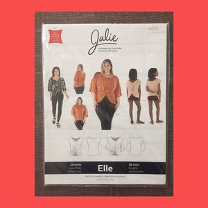 May include: A sewing pattern for a twist-front top, called "Elle", from Jalie Sewing Patterns. The pattern is available in 28 sizes for girls and women. The pattern shows a model wearing a rust-colored top with a twist detail in the front.