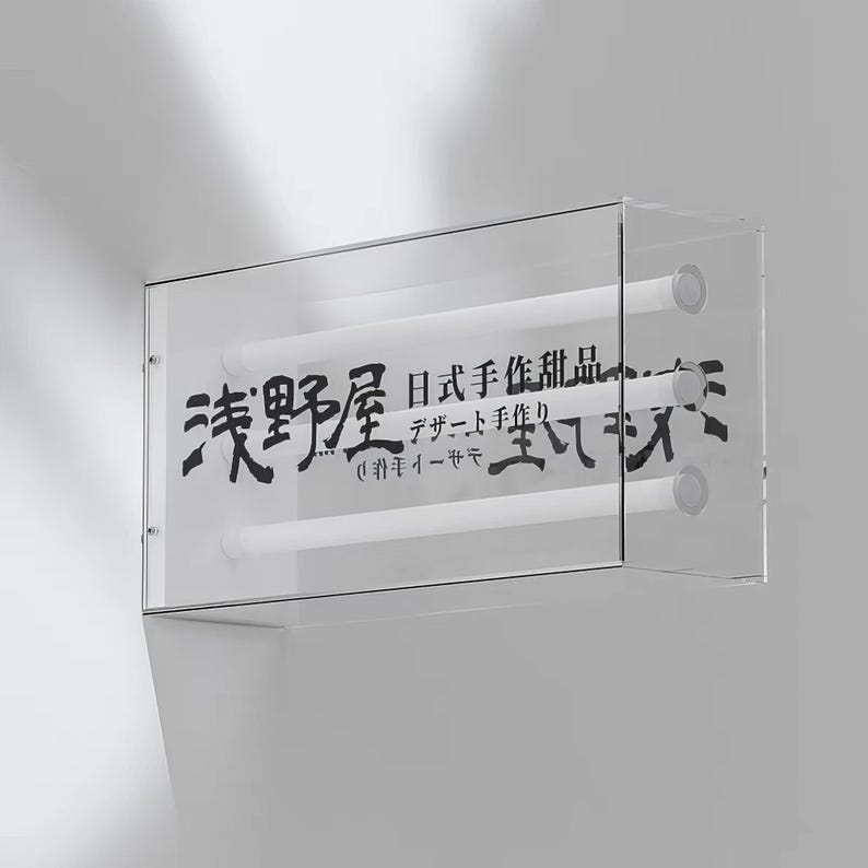 May include: A clear acrylic sign with the text "美野星" in black Japanese characters. The text below reads "Japanese handmade design - handmade jewelry - 美野星".