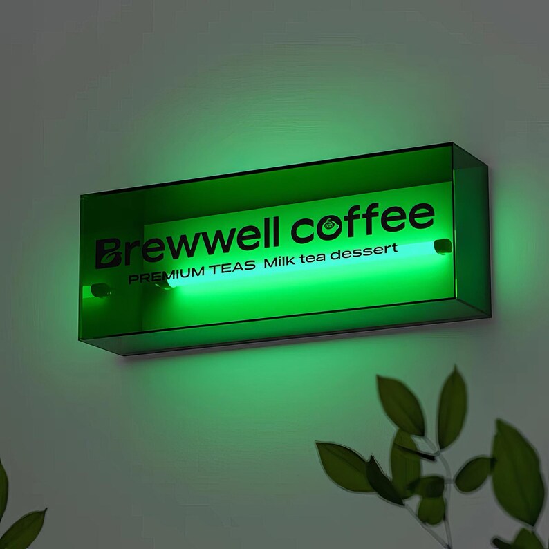 May include: A green neon sign with the text "Brewwell coffee" and the words "PREMIUM TEAS Milk tea dessert" underneath.