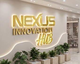 May include: A wall-mounted sign featuring the gold-colored 3D text NEXUS INNOVATION HUB with integrated backlighting. The sign is positioned above a row of six green potted plants in light-colored square planters against a beige wall.