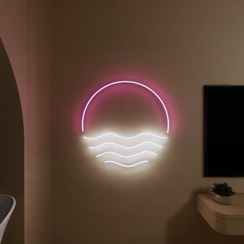 Puede incluir: Un letrero de ne&oacute;n rosa y blanco con un c&iacute;rculo y olas. El letrero est&aacute; montado en una pared.