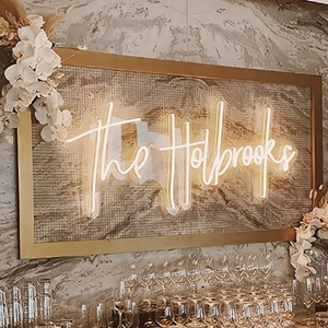 The sign exudes modern charm and is perfect for personalized home decor or unique wedding signage