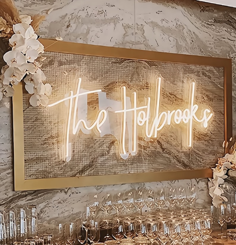 The sign exudes modern charm and is perfect for personalized home decor or unique wedding signage