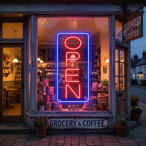May include: A shopfront window displaying a vibrant red and blue neon sign reading OPEN. The window contains assorted grocery products, hessian sacks, and potted plants. A sign above the window reads GROCERY & COFFEE, with a matching hanging sign.