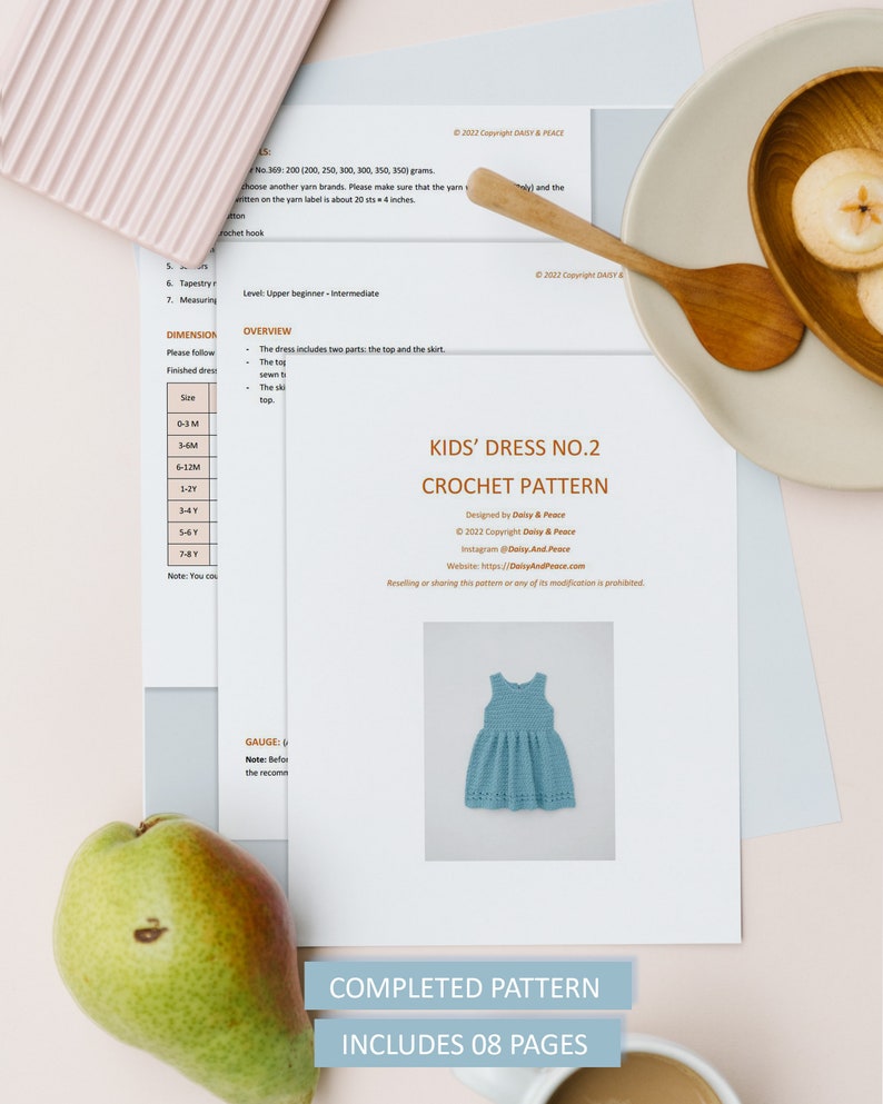 May include: A crochet pattern for a kids' dress, titled "Kids' Dress No. 2 Crochet Pattern". The pattern is designed by Daisy & Peace and includes 8 pages. A photo of a completed blue dress is shown.
