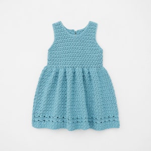 May include: A light blue sleeveless crochet dress with a gathered skirt.