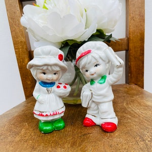 Pair of Kitsch Mid Century Boy and Girl Figurines