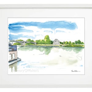 May include: Watercolour painting of a river scene with a bridge, a building, and a boat. The sky is blue with white clouds. The water is a light blue with reflections of the sky and trees. The trees are green and the building is white. The boat is brown and has a white roof. The painting is signed "Memory Makers" in the bottom left corner and "Marian Miller" in the bottom right corner.