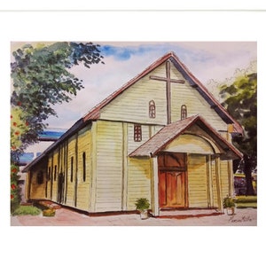 May include: Watercolour painting of a yellow church with a brown door and a cross on the roof. The church is surrounded by green trees and bushes.