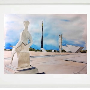 May include: Watercolour painting of a cityscape in a white frame. The artwork shows a statue in the foreground, with modern architecture and a tall flag pole in the background. The sky is blue with white clouds.