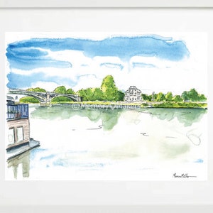 May include: Watercolour painting of a river scene with a bridge, a house, and trees. The sky is blue with white clouds. The water is a light blue-green colour. The painting is signed "Memory Maker" in the bottom right corner.