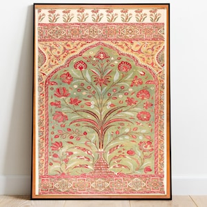 May include: Framed art print featuring a stylized tree with red flowers and green leaves, set against a light green background. The artwork is framed in a black frame with a decorative border. The print is displayed on a wooden floor.