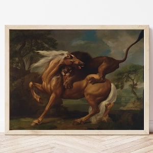 May include: A framed painting depicts a dynamic scene of a lion attacking a horse. The horse is a light brown color with a white mane and tail. The lion is a darker brown. The background features trees and a cloudy sky.