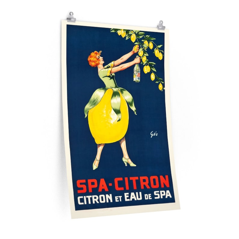 May include: Vintage poster advertising Spa-Citron, a lemon-flavored beverage. A woman in a green dress with a lemon-shaped skirt holds a bottle of Spa-Citron and picks lemons from a tree. The poster has a blue background with the text "Spa-Citron Citron et Eau de Spa" in red and white.
