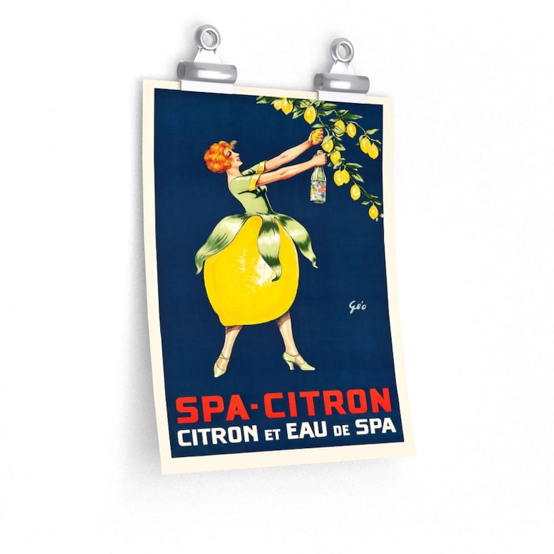 May include: A vintage poster advertising Spa-Citron, a lemon-flavored beverage. The poster features a woman dressed in a yellow lemon-shaped dress, reaching for a bottle of Spa-Citron hanging from a lemon tree. The text on the poster reads "Spa-Citron Citron et Eau de Spa."