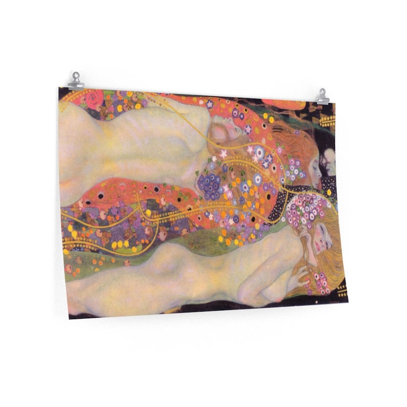 May include: A painting of three women with flowing hair and nude bodies, lying on a bed of flowers and gold. The women are surrounded by a swirling pattern of flowers, leaves, and gold.