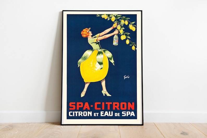May include: A vintage poster advertising Spa-Citron, a lemon-flavored beverage. The poster features a woman dressed in a lemon-shaped dress, reaching for a bottle of Spa-Citron hanging from a lemon tree. The text on the poster reads "Spa-Citron Citron et Eau de Spa."