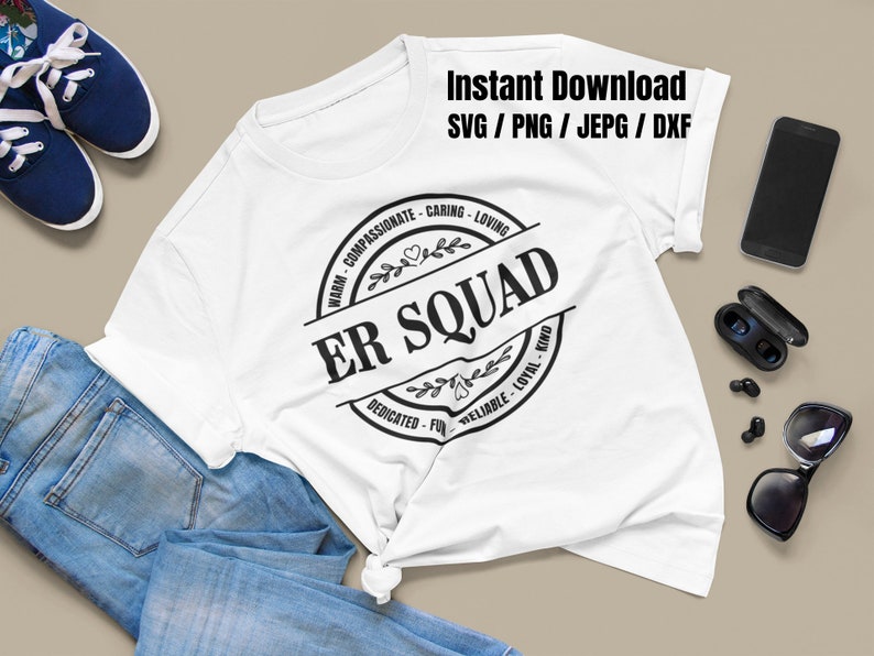 May include: White t-shirt with a black circle design that says "ER SQUAD" with a wreath around it. The words "WARM-COMPASSIONATE-CARING-LOVING" are above the circle and "DEDICATED-FUN-RELIABLE-LOYAL-KIND" are below the circle.
