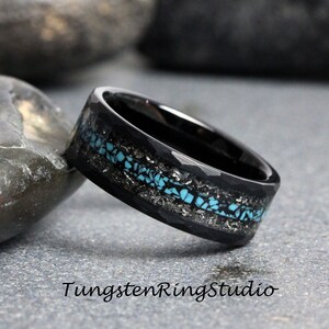 May include: Black tungsten carbide ring with a hammered finish and a turquoise inlay. The inlay is set in a silver-colored metal.