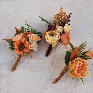 Fall boutonniere with orange fake flowers for men, wedding boutonniere