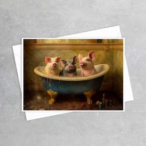 May include: A greeting card featuring a blue clawfoot bathtub with gold feet, containing three pigs: two pink pigs on the sides and one grey pig in the center. The pigs are surrounded by white bubbles, set against a yellow patterned wall background.