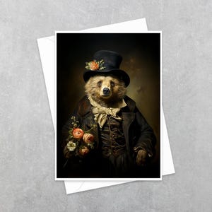 May include: A greeting card featuring a brown bear dressed in a dark coat, a vest, and a cravat, wearing a black top hat adorned with an orange flower. The bear holds a small bouquet of orange and white flowers against a dark, moody background.