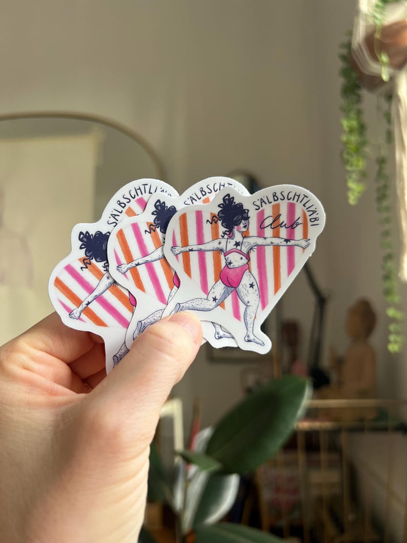 May include: Several stickers depicting a figure in a pink swimsuit with star details, set against a heart-shaped backdrop with orange and pink stripes. The text "SALBSCHTLI Club" is visible on each sticker.