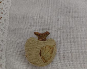 A chic vintage apple brooch