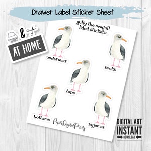 May include: A sheet of drawer label stickers featuring watercolor illustrations of seagulls. Each seagull sticker is labeled with clothing items such as underwear, socks, tops, bottoms, and pajamas. The sheet also includes a sticker that says "At Home".