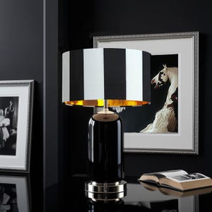Classic and modern luxurious lampshade with stripes in im black and white.