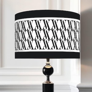 Classic and modern luxurious lampshade with stripes in im black and white.