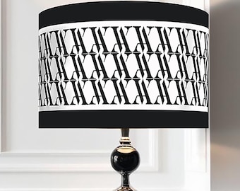 Classic and modern luxurious lampshade with stripes in im black and white.