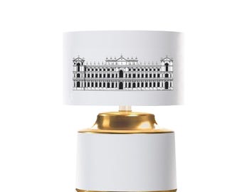 Amazing small lamp classic and modern. Unique. With an architectural motif. Gold finish.