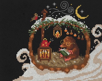 May include: Cross stitch pattern featuring a small witch reading a book by a fireplace in a cozy cabin. The cabin is nestled in a snowy landscape with a crescent moon and stars in the night sky. The pattern is titled "Mama Witch Xstitch" and includes the text "Cross Stitch Patterns".