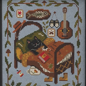 以下が含まれることがあります： 黒い猫が本と紅茶のカップ、そしてその他の居心地の良いアイテムと一緒にベッドで寝ているクロスステッチパターン。パターンは黒いフレームで囲まれており、青い背景になっています。フレームの下には「Mama Witch Xstitch」と「Cross Stitch Patterns」のテキストがあります。