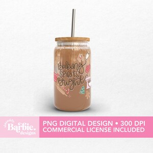 May include: A clear glass tumbler with a wooden lid and a silver straw, filled with a brown liquid. The tumbler is decorated with baking-themed graphics and the phrase "Baking Spirits Bright".